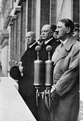 Dorpmüller with Lammers and Hitler on 4 February 1937 on the balcony of the Reich Chancellery at a rally after his appointment as Reich Minister of Transport on 2 February 1937