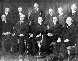 The Brüning I Cabinet on 31 March 1930: f. l. t. r. seated Minister of the Interior Joseph Wirth (Center), Minister of Economics Hermann Dietrich (DDP), Reich Chancellor Brüning, Minister of Foreign Affairs Julius Curtius (DVP), Minister of Posts Georg Schätzel (BVP), standing Minister for the Occupied Territories Gottfried Reinhold Treviranus (Conservative People's Party), Minister of Food Martin Schiele (DNVP), Minister of Justice Johann Viktor Bredt (Economics Party), Minister of Labor Adam Stegerwald (Center), Minister of Finance Paul Moldenhauer (DVP), Minister of Transport Theodor von Gerard (Center). Reichswehr Minister Wilhelm Groener is missing from the picture.