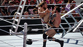 Bryan voert de Running Knee uit op Bad News Barrett tijdens WrestleMania 31  