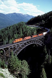 An eastbound freight train on the Stoney Creek Bridge near Rogers Pass (1988).