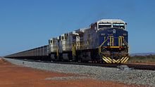 Iron ore train on the heavy haulage track of Fortescue Metals Group in Australia