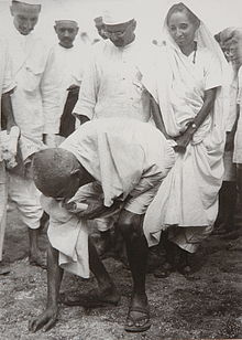 April 5, 1930: Gandhi picks up salt on the beach of the Arabian Sea at the finish and end of the Salt March.