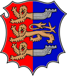 Escudo de Hastings. El emblema heráldico de los Cinque Ports es la mitad delantera de un león unida al lomo de un barco. Aparece en los escudos de varias ciudades y en el estandarte heráldico (bandera) del Lord Warden de los Cinque Ports.