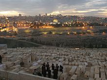 Communal Kaddish prayer in Jerusalem to commemorate the dead at the grave