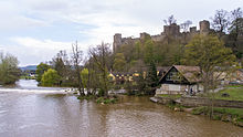 Ludlow Castle, built on a rocky headland, seen here across the River Teme.