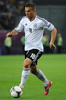 Podolski in the national team jersey in a match scene during the 2012 European Championship.
