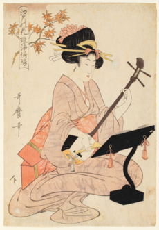 Een geisha die op de shamisen speelt. Ukiyo-e schilderij van kunstenaar Kitagawa Utamaro, 1803.  