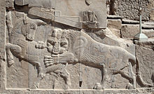 The fight between the bull (symbol for the earth) and the lion (symbol for the sun) as a symbol of the Zoroastrian Nouruz, Persepolis, Iran