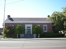 The Omak Post Office, operated by the United States Postal Service (USPS).