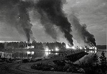 Finnish soldiers set fire to houses during their retreat in the summer of 1944 to prevent the enemy from using them.