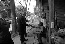 President Johnson on his tour of poor neighborhoods in May 1964. . 