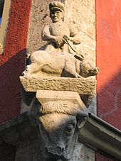 Butcher statue on the corner of a house in Rothenburg ob der Tauber