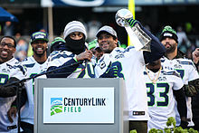 Russell Wilson, Marshawn Lynch with the Lombardi Trophy