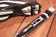 The SNS Pilot binding uses a second metal axle in the boot for a tension spring (white) for stabilization.