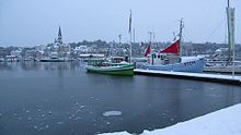 Winter in Flensburg: View of the harbour, the fjord and the district Jürgensby. In the foreground the tugboat Solitüde from 1943 and the fishing cutter Jægerpris from 1960 (January 2013).