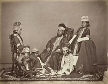 Studio portrait of a mogul with his children in Delhi by Sheperd and Robertson, c. 1860s.