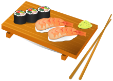Una bandeja de sushi con un par de palillos.  