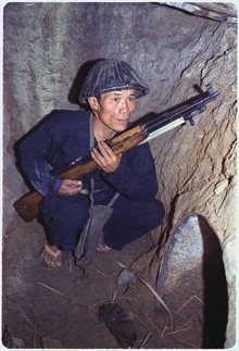 NLF fighter in 1968 in an earth bunker